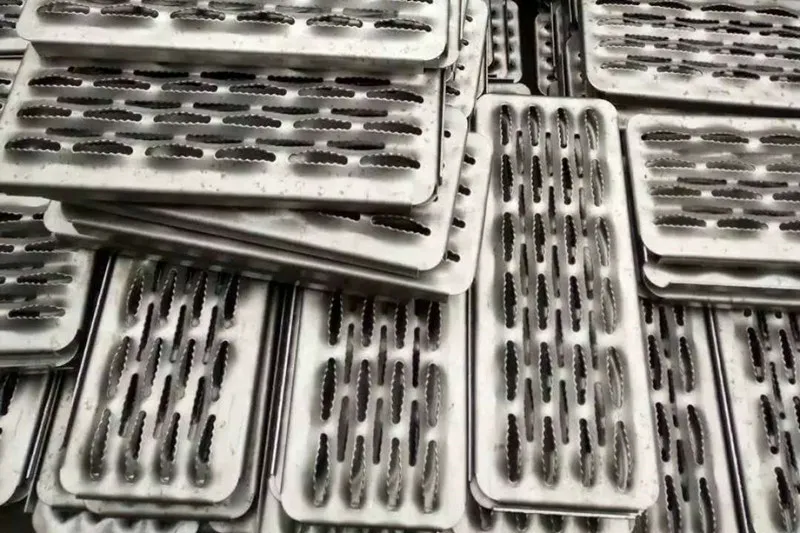 B2B engineering sample pack — Grip Strut and Perf-O Grip safety grating cutouts displayed